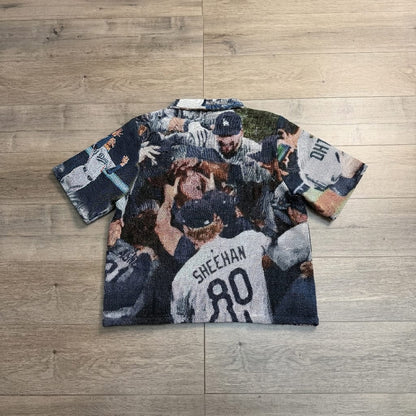 CHAMPIONS 2025 V2 TAPESTRY TEE